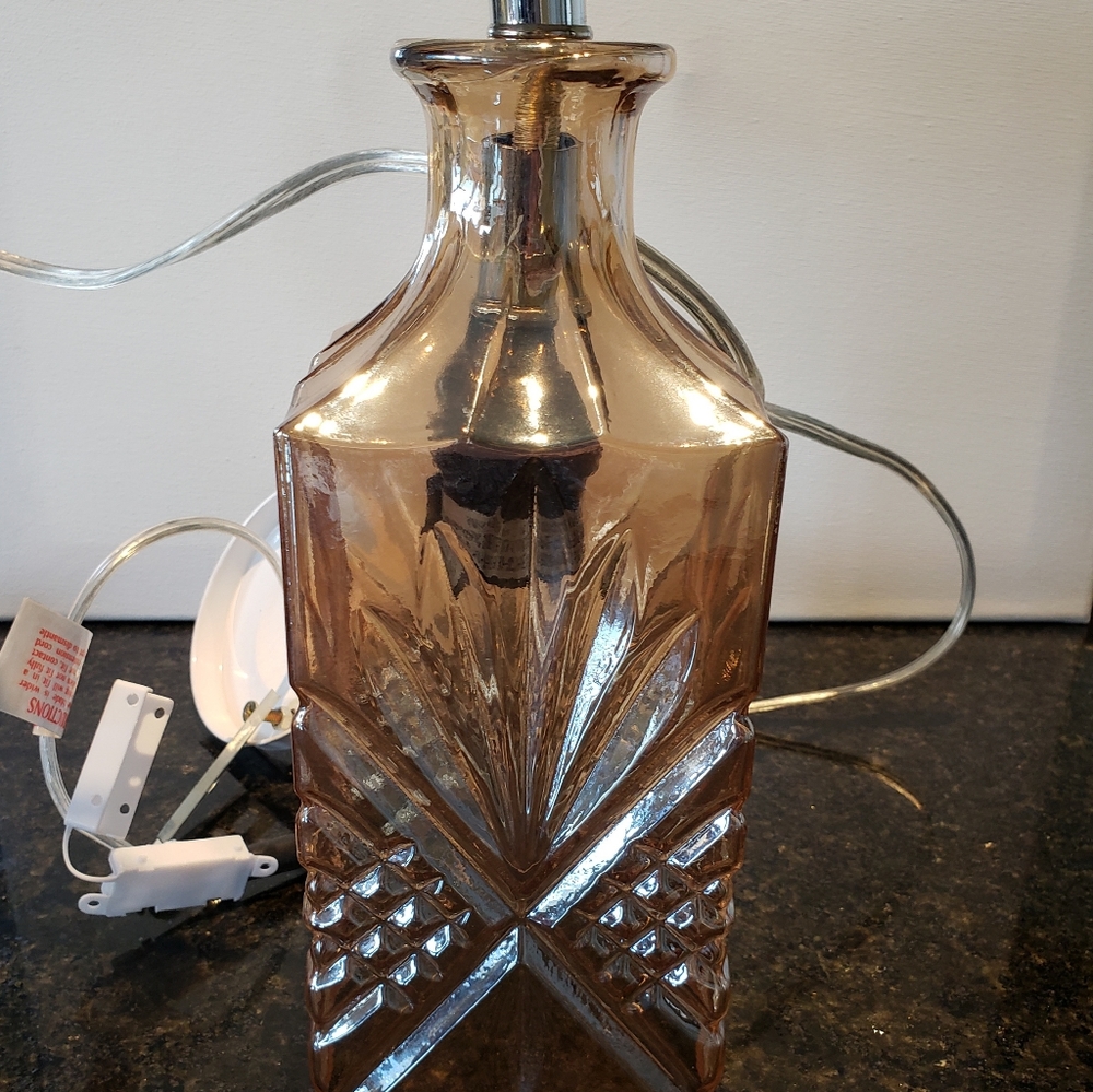 Swag lamp and glass shade.